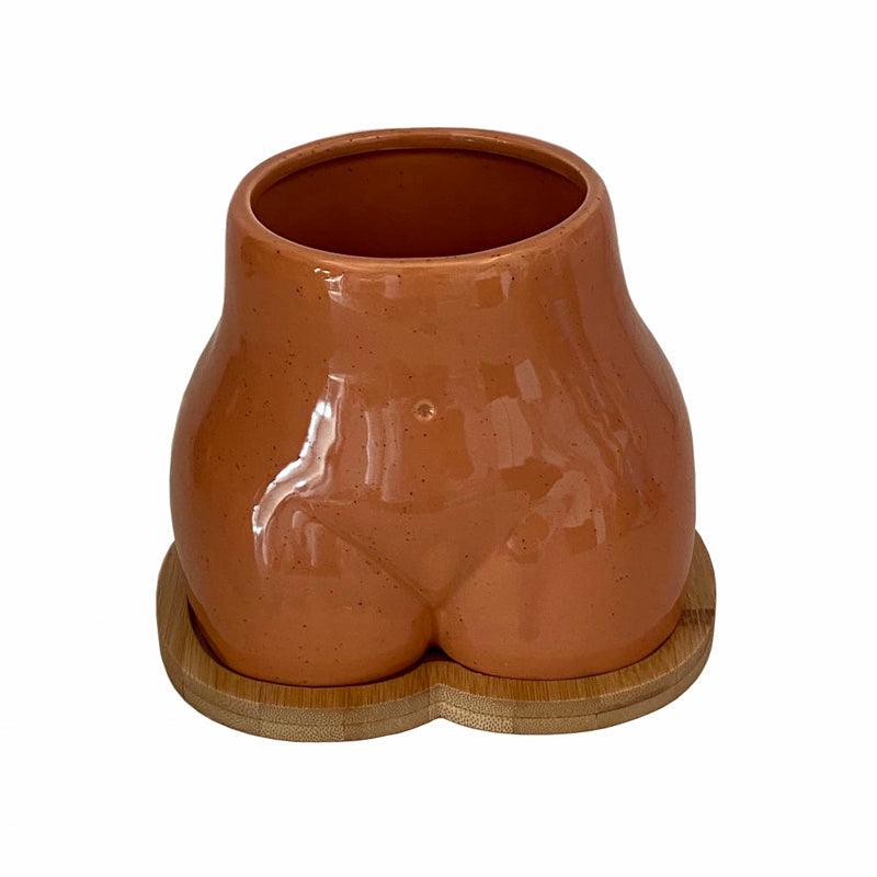 An Ornamental Ceramic Vase In The Shape Of A Human Hip