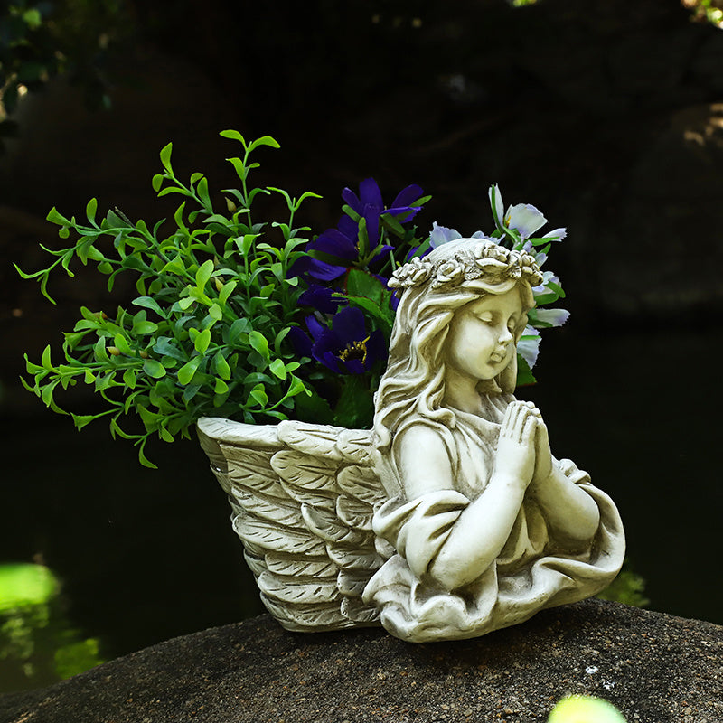 Creative angel flower pot garden layout