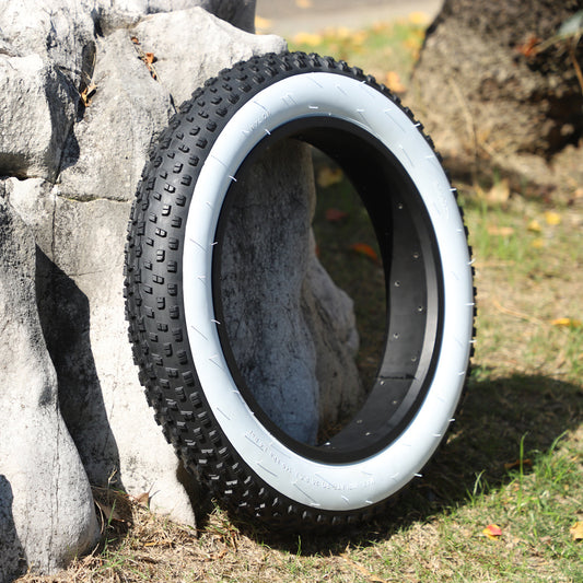 Folded Snow Tire With White Edge Outside The Beach