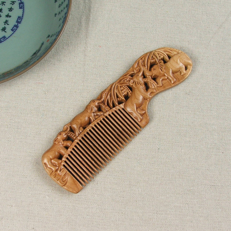 Carved wooden comb