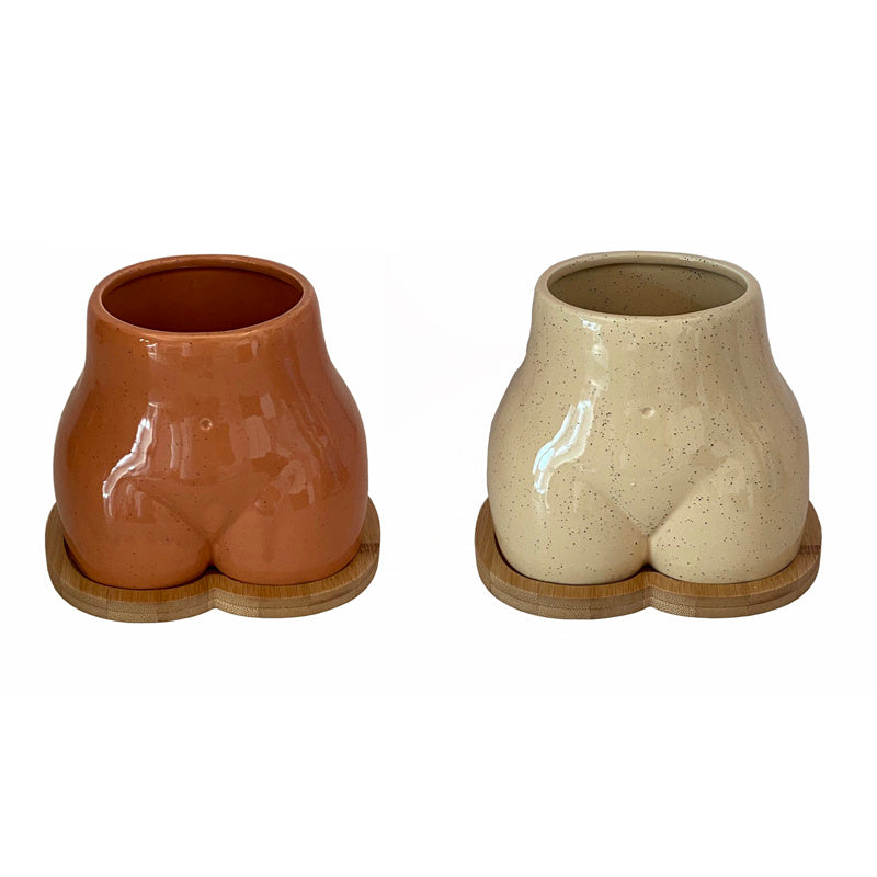 An Ornamental Ceramic Vase In The Shape Of A Human Hip